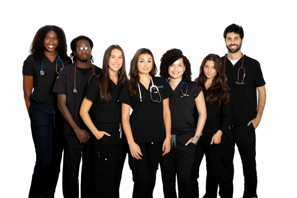 Total Spine and Orthopedics clinical staff in black scrubs
