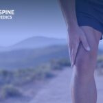 An image of a man holding his knee in pain.
